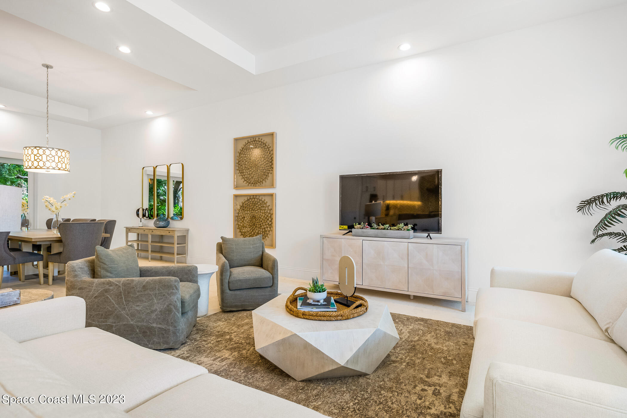 Undisclosed Address Vero Beach, FL 32963 - Photo 5 of 36 a living room with furniture and a flat screen tv