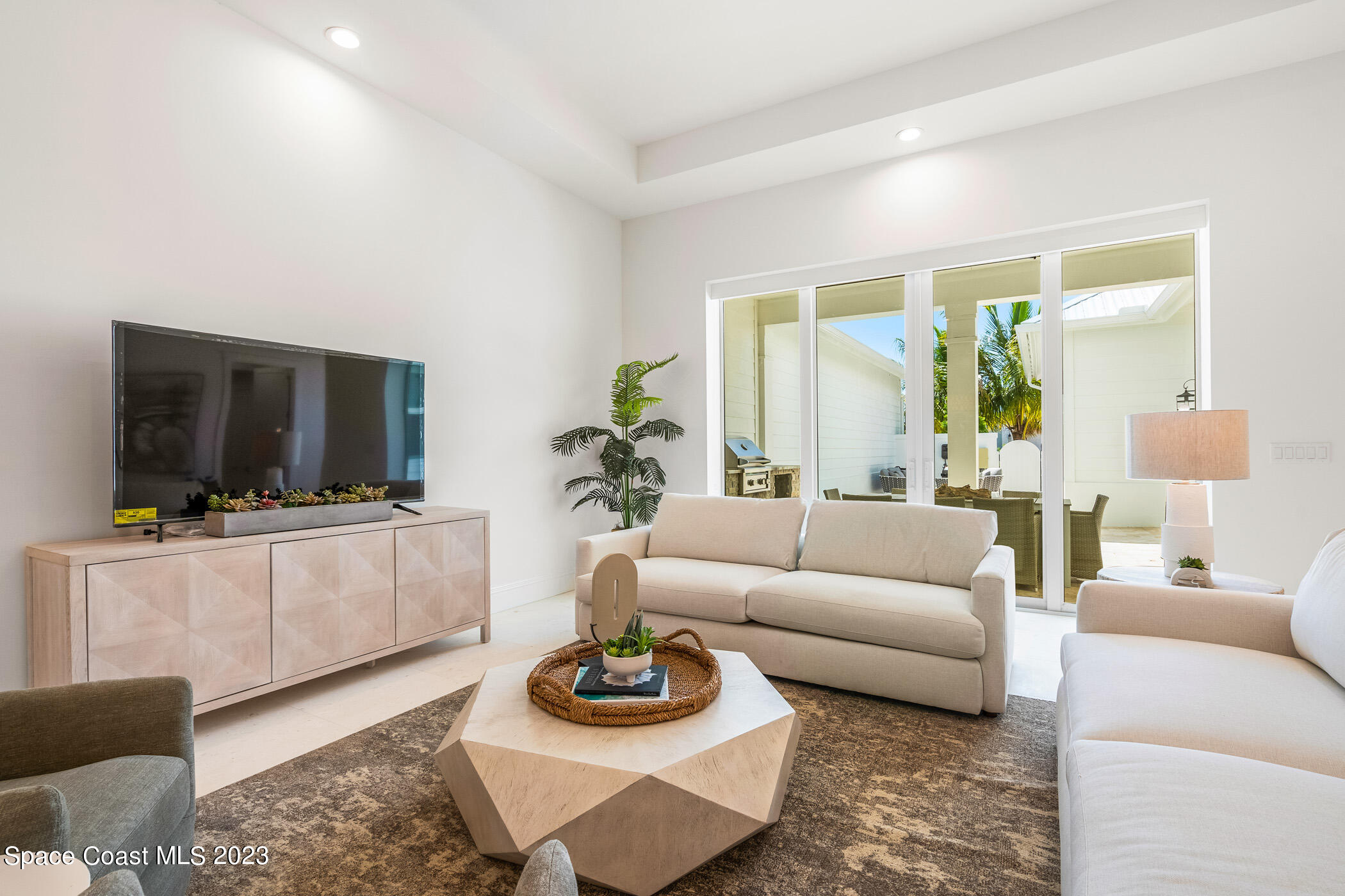 Undisclosed Address Vero Beach, FL 32963 - Photo 6 of 36 a living room with furniture and a flat screen tv