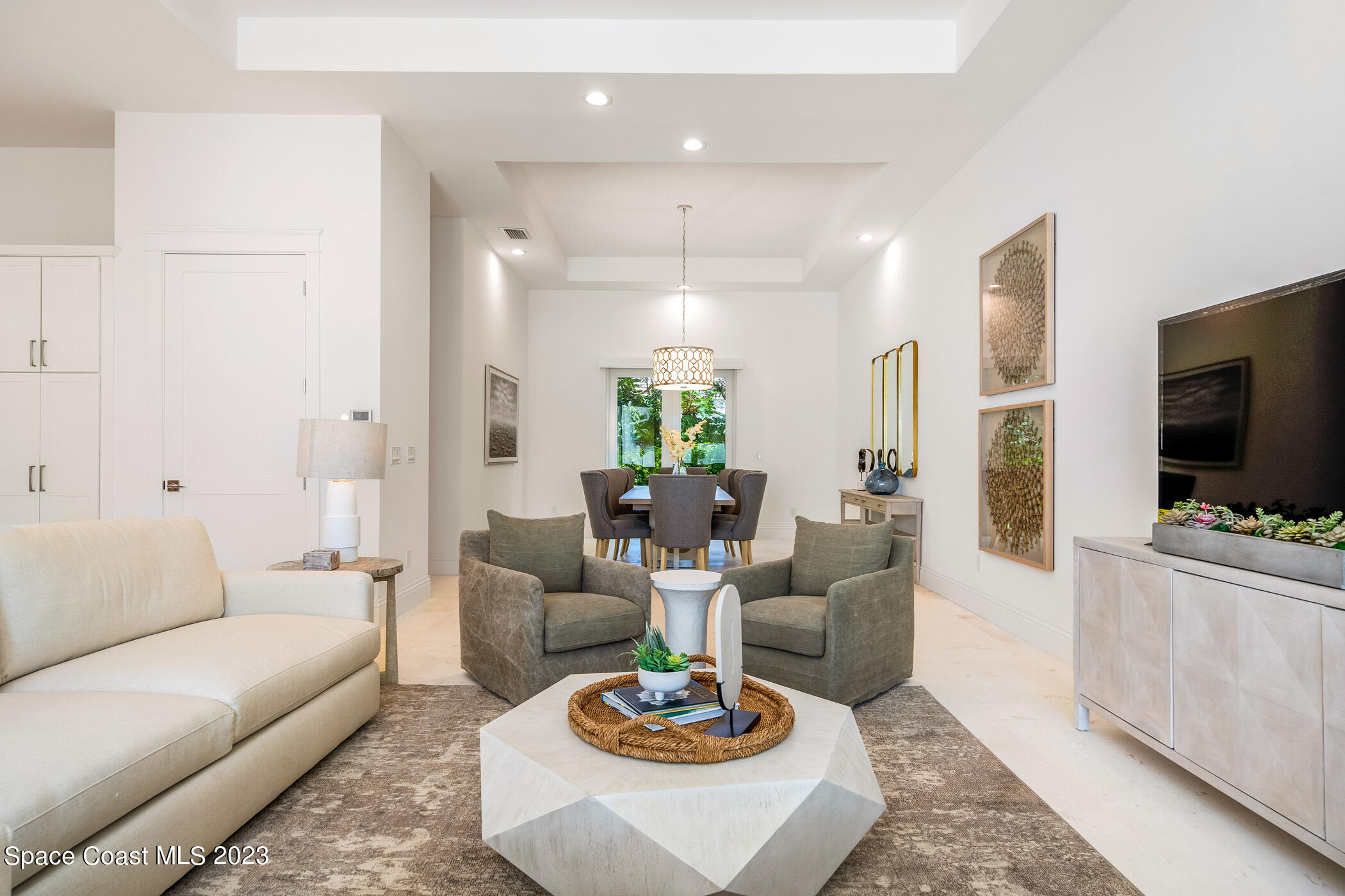 Undisclosed Address Vero Beach, FL 32963 - Photo 7 of 36 a living room with fireplace furniture and a flat screen tv