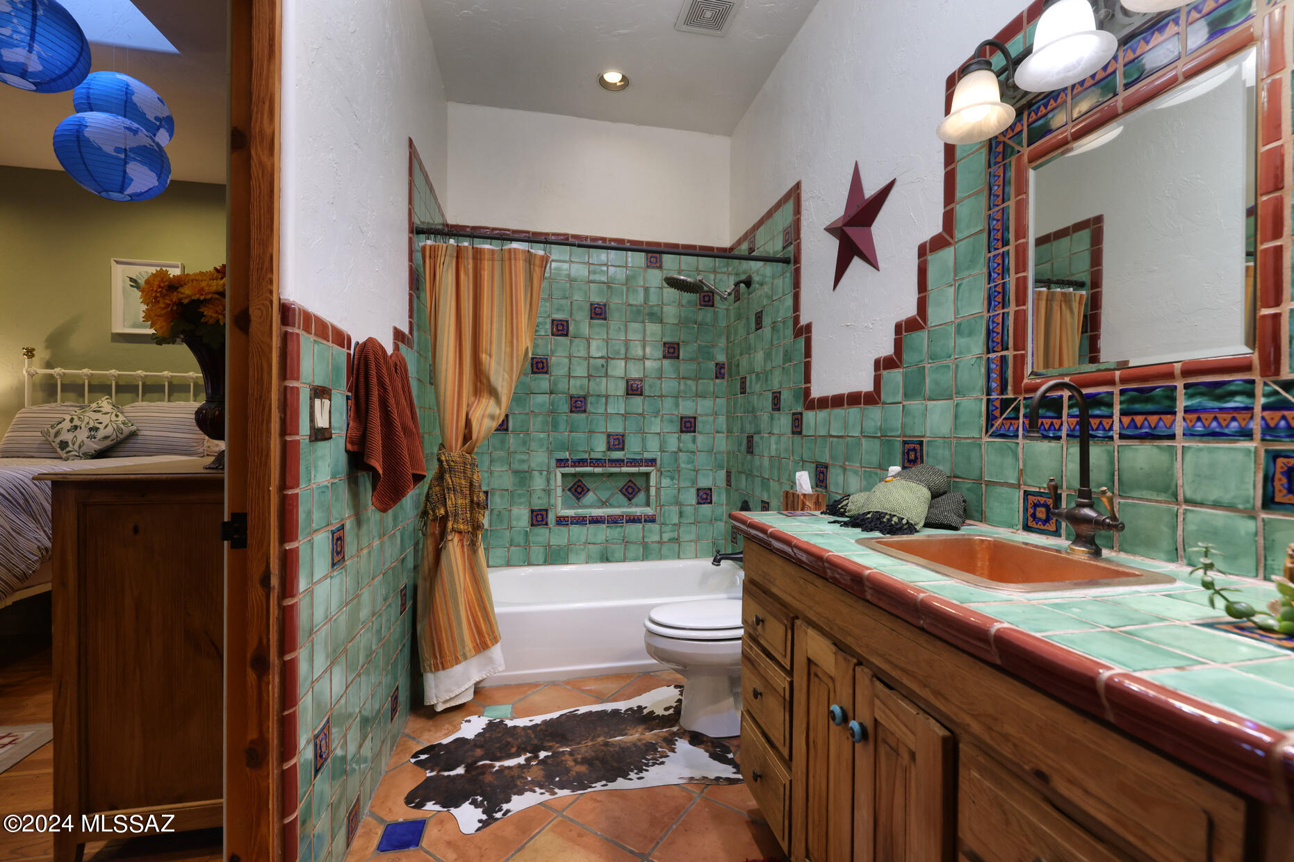 11725 East Spanish Ridge Place Tucson, AZ 85730 - Photo 32 of 51 a bathroom with a sink a toilet and shower