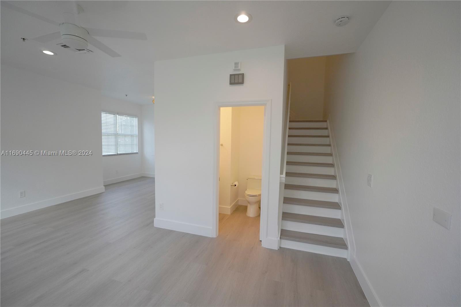 123 Harbors Way Boynton Beach, FL 33435 - Photo 19 of 38 a view of entryway and hall with wooden floor