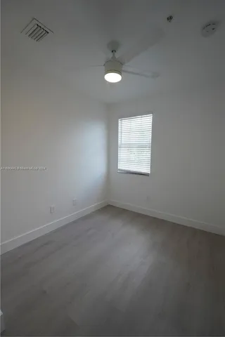 an empty room with a bathroom