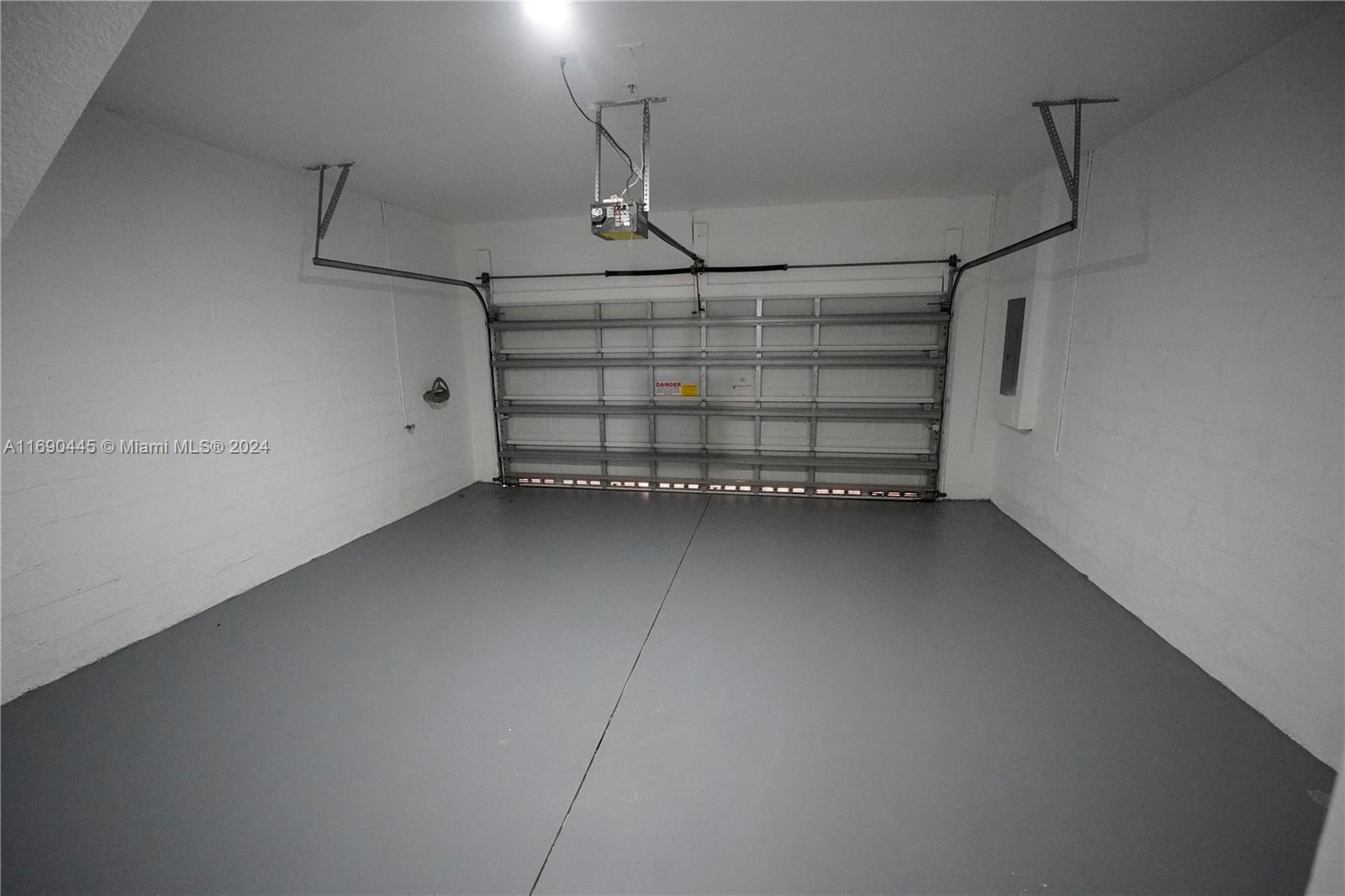123 Harbors Way Boynton Beach, FL 33435 - Photo 7 of 38 a view of a room with racks on the wall