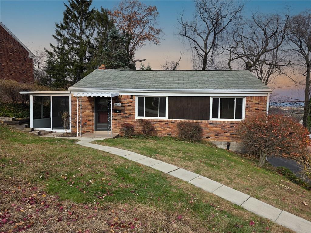 front view of a house with a yard