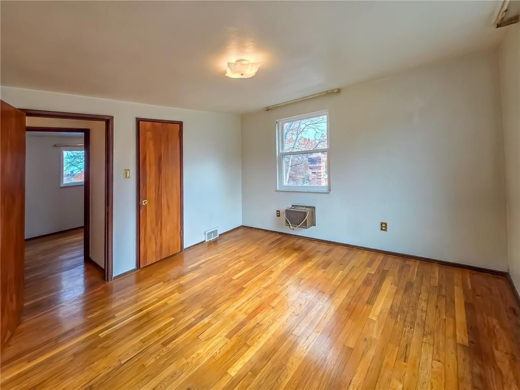 1494 Blossom Hill Road Pittsburgh, PA 15234 - Photo 15 of 40 a view of empty room with wooden floor and fan