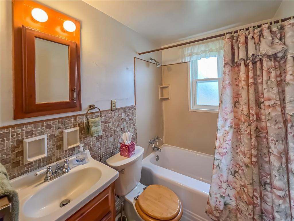 1494 Blossom Hill Road Pittsburgh, PA 15234 - Photo 25 of 40 a bathroom with a sink toilet bathtub and shower