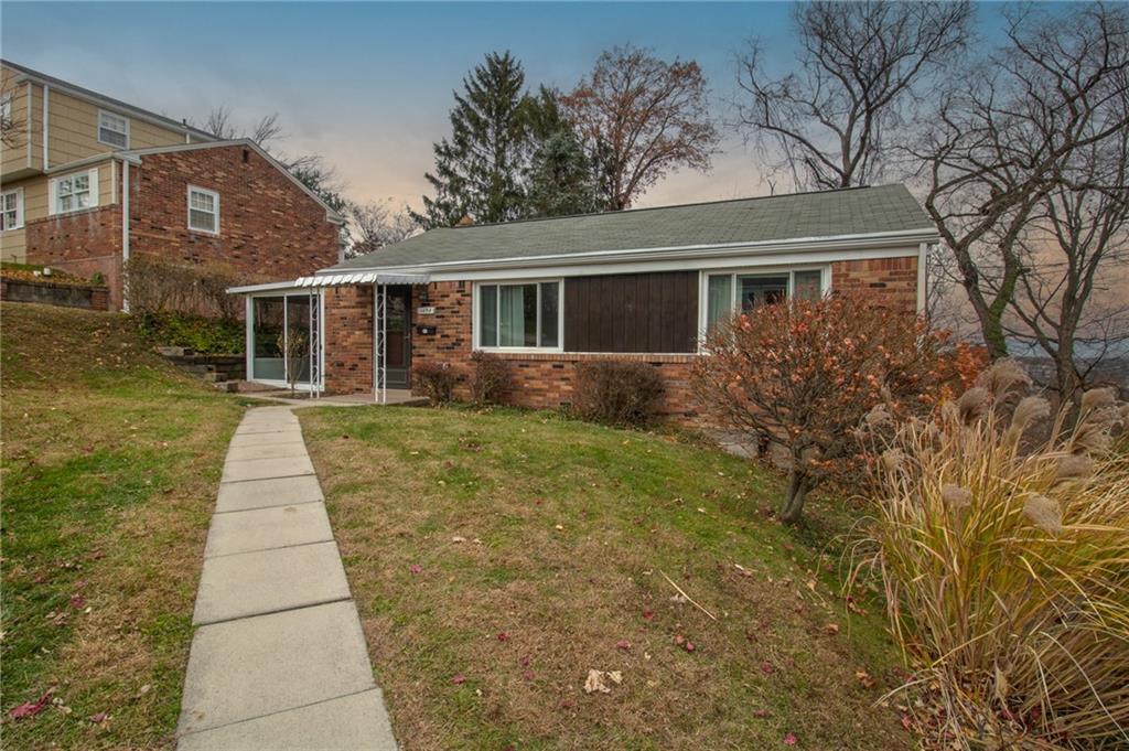 1494 Blossom Hill Road Pittsburgh, PA 15234 - Photo 6 of 40 front view of a house with a yard
