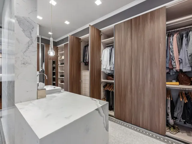 a kitchen with stainless steel appliances a sink stove and refrigerator