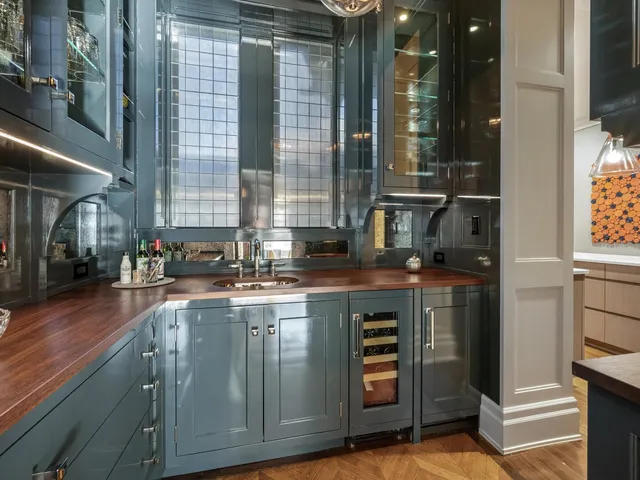 a kitchen with a sink and cabinets