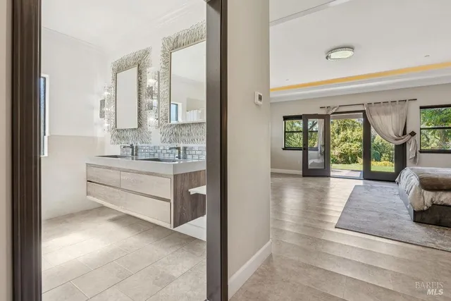 a bedroom with a large bed and a large window