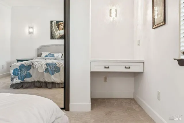 a view of a hallway with closet and utility room