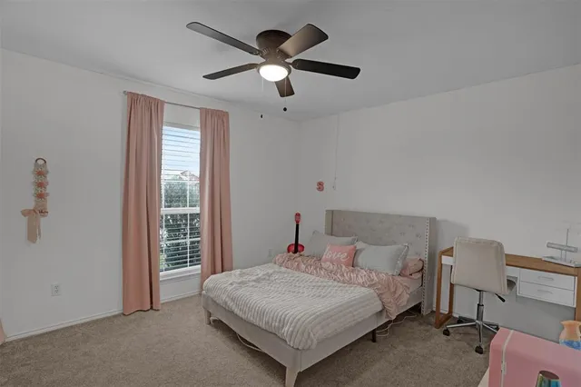 a bathroom with a tub a sink and mirror