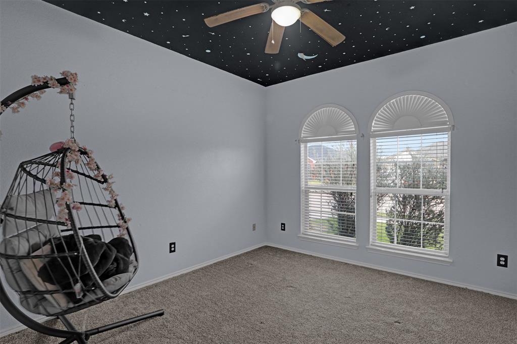 1005 Caleb Street Burleson, TX 76028 - Photo 18 of 31 a view of a livingroom with a ceiling fan