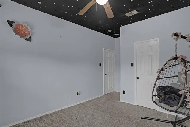 a view of a livingroom with a ceiling fan