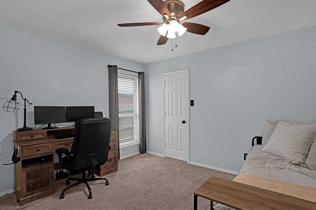 1005 Caleb Street Burleson, TX 76028 - Photo 20 of 31 a bedroom with a workspace