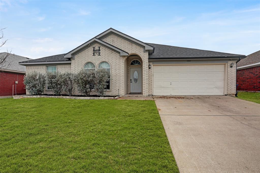 1005 Caleb Street Burleson, TX 76028 - Photo 29 of 31 a front view of house with yard and garage