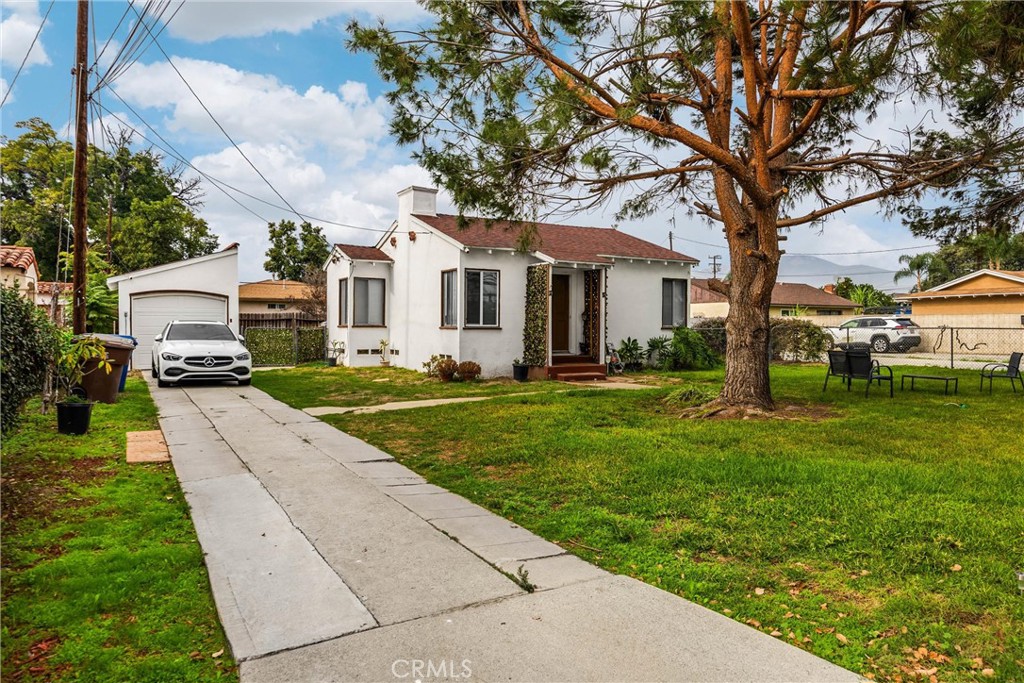 4229 Cogswell Road El Monte, CA 91732 - Photo 2 of 12 a front view of house with yard and green space