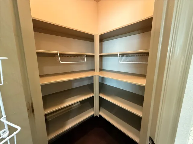 a front view of a house with a tree