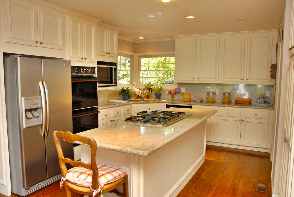 167 Toyon Road Atherton, CA 94027 - Photo 8 of 25 a kitchen with a refrigerator a stove a sink and a cabinets
