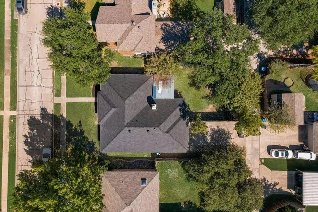 an aerial view of a house with a garden