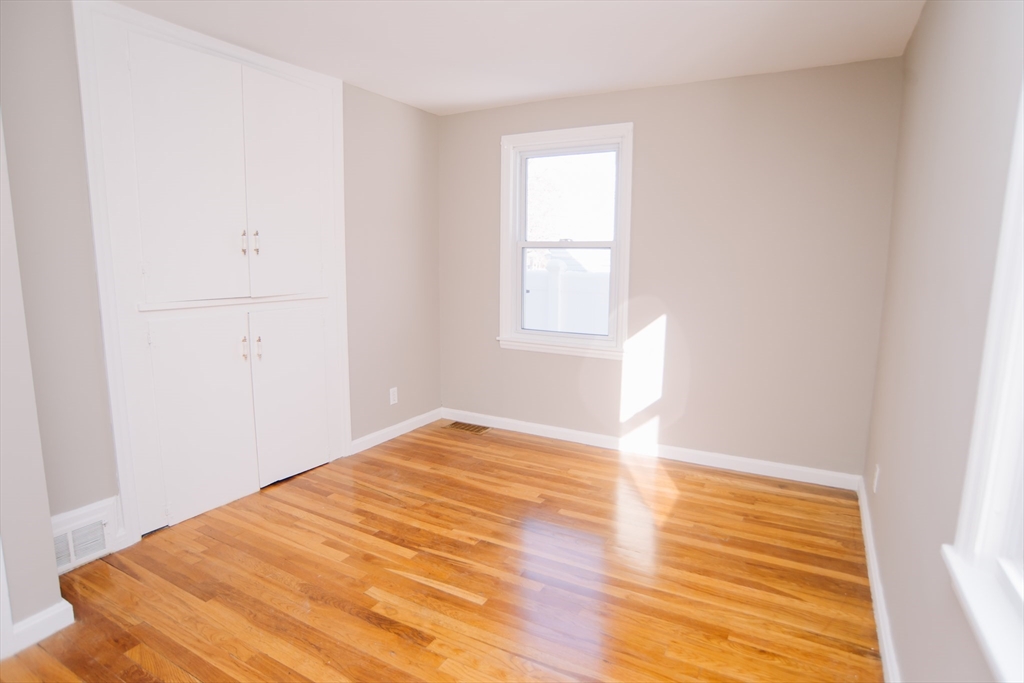 75 Lumae Street Springfield, MA 01119 - Photo 17 of 38 a view of empty room with wooden floor