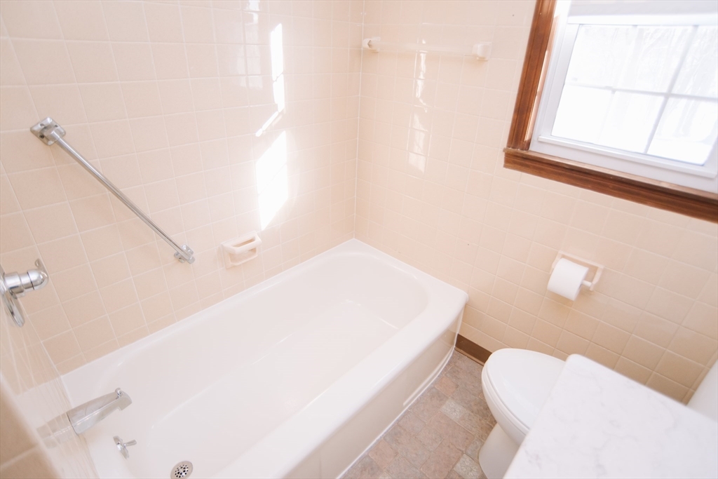 75 Lumae Street Springfield, MA 01119 - Photo 23 of 38 a bathroom with a toilet sink and mirror