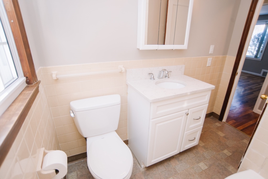 75 Lumae Street Springfield, MA 01119 - Photo 24 of 38 a bathroom with a sink a toilet and a mirror