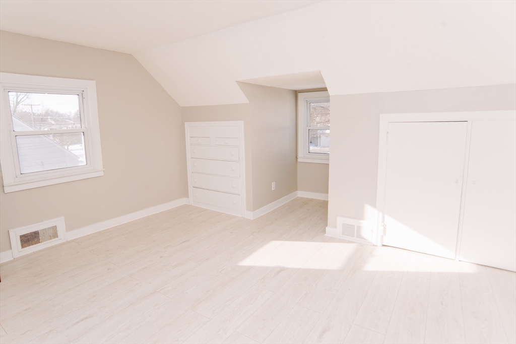 75 Lumae Street Springfield, MA 01119 - Photo 29 of 38 an empty room with windows and entrance