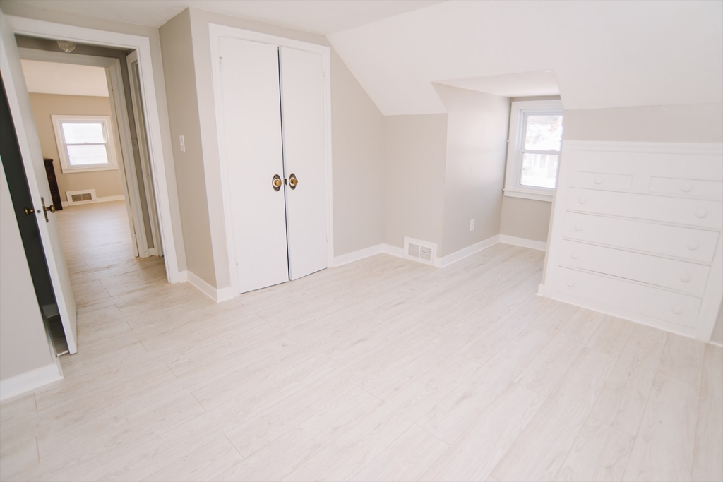 75 Lumae Street Springfield, MA 01119 - Photo 34 of 38 an empty room with mirror and entrance