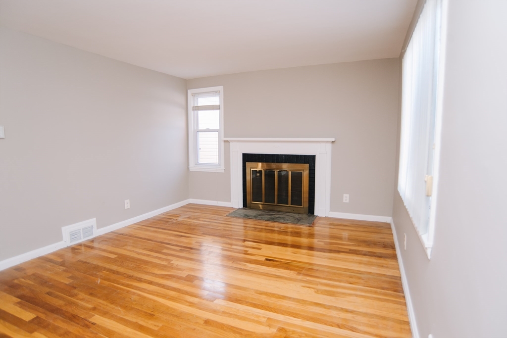 75 Lumae Street Springfield, MA 01119 - Photo 9 of 38 a view of empty room with a fireplace