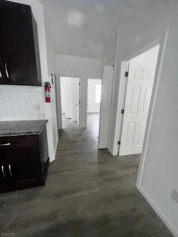 a view of a livingroom with an empty space and a fireplace