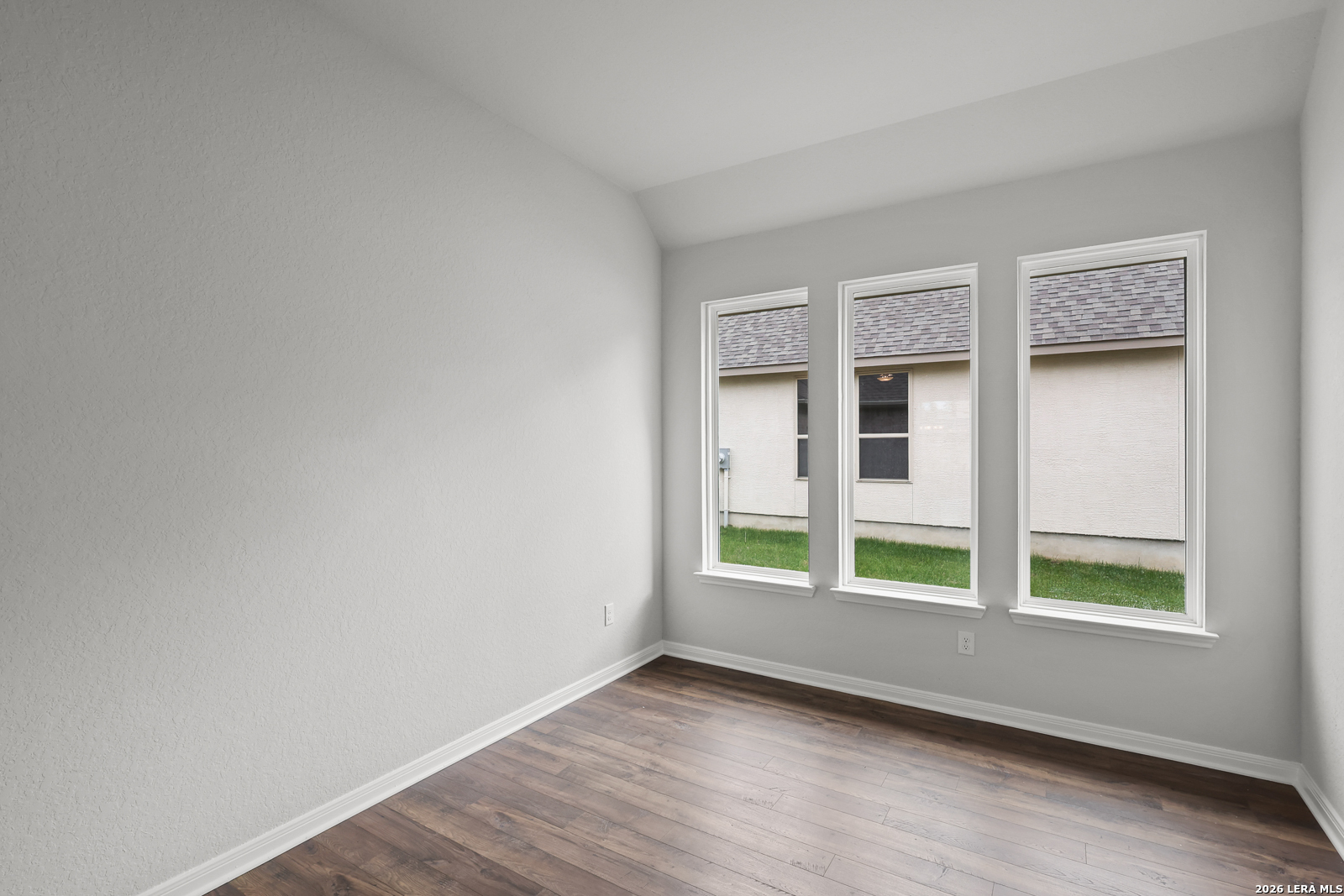 220 Fillmore Falls Cibolo, TX 78108 - Photo 20 of 30 a view of an empty room with a window and wooden floor