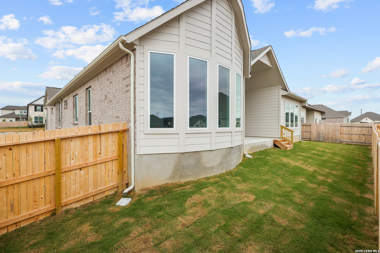 220 Fillmore Falls Cibolo, TX 78108 - Photo 23 of 30 a view of a house with a backyard and stairs