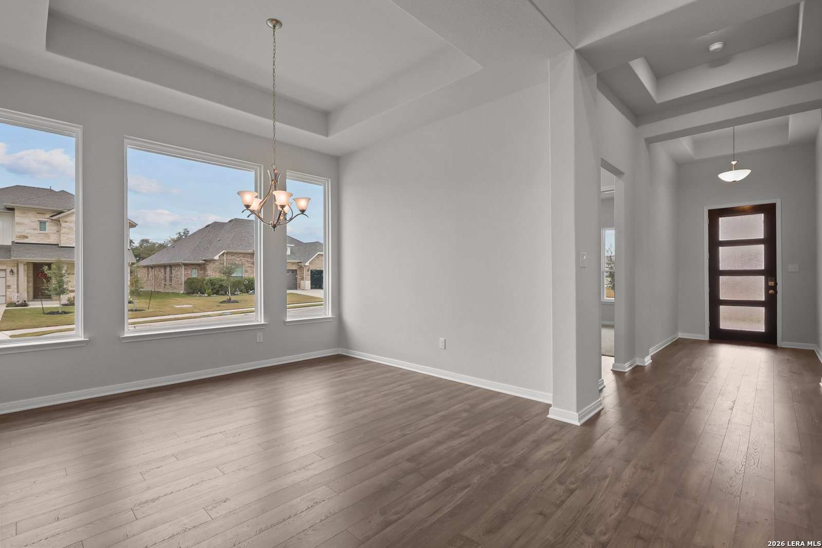 220 Fillmore Falls Cibolo, TX 78108 - Photo 3 of 30 a view of a big room with wooden floor and windows