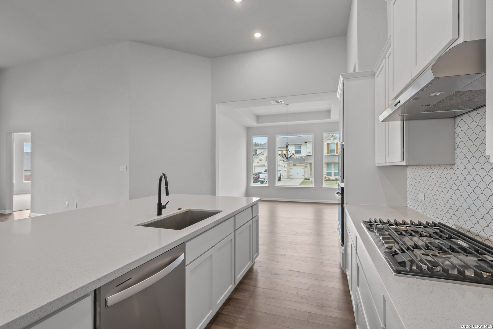 220 Fillmore Falls Cibolo, TX 78108 - Photo 8 of 30 a kitchen with stainless steel appliances granite countertop a sink stove and cabinets