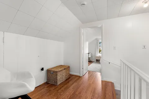 a hallway with wooden floor