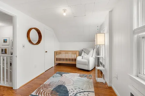 a bedroom with furniture and a window