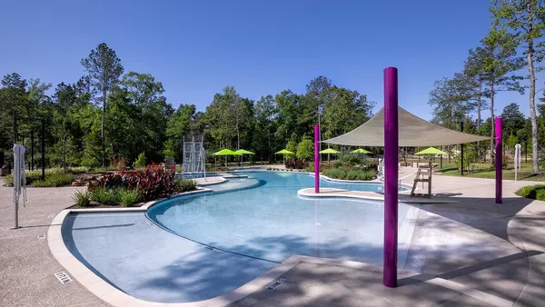 a view of swimming pool with a table and chairs