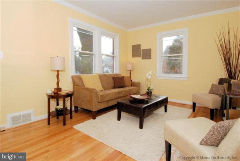 10208 Colesville Road Silver Spring, MD 20901 - Photo 3 of 10 a living room with furniture and a window