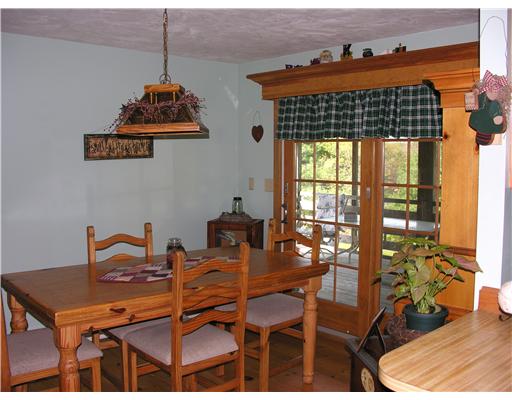 148 East Killingly Road Foster, RI 02825 - Photo 4 of 10 Dining Room. The dining room opens to a screened porch with a view of the backyard and pool.