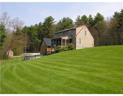 148 East Killingly Road Foster, RI 02825 - Photo 9 of 10 Exterior Back. Wooded setting offers privacy and quiet enjoyment.