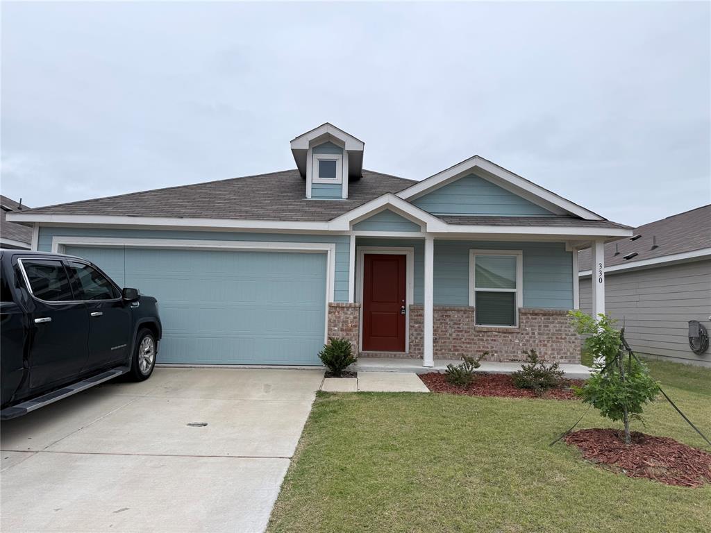 330 Ashbrook Way Princeton, TX 75407 - Photo 1 of 11 a front view of a house with garden