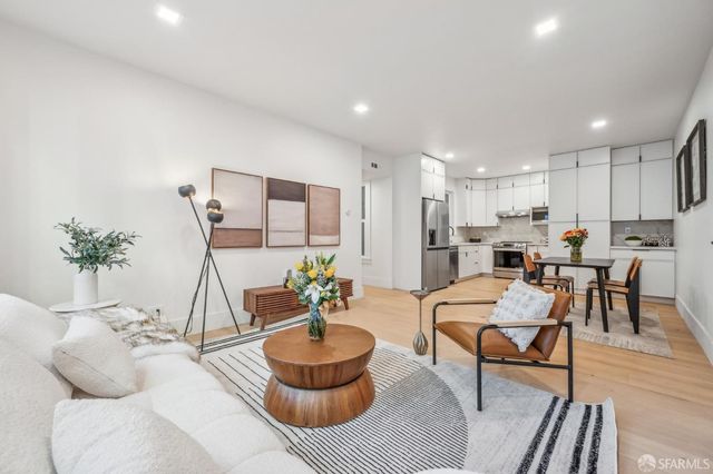 a living room with furniture and a table