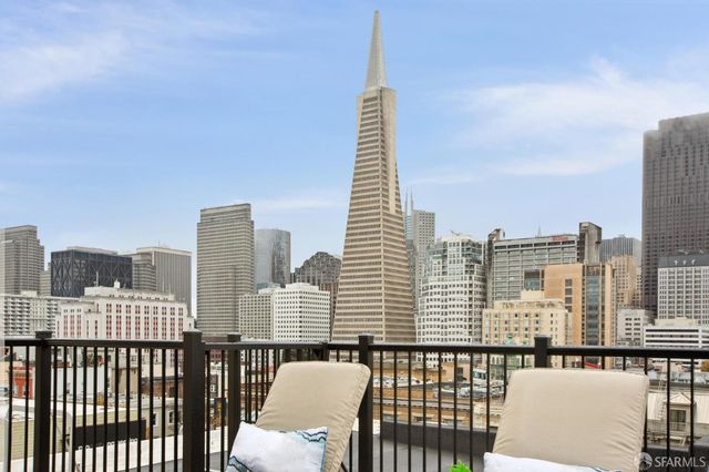 a view of a balcony with city view