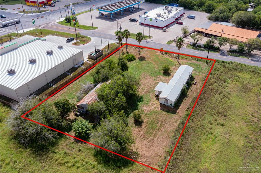 0 North Sam Houston Boulevard Rio Hondo, TX 78583 - Photo 2 of 6 an aerial view of a house with a swimming pool