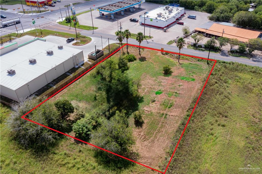 0 North Sam Houston Boulevard Rio Hondo, TX 78583 - Photo 3 of 6 a view of a swimming pool with a yard and potted plants