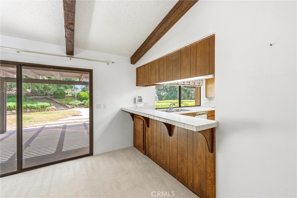 37295 Oak View Road Yucaipa, CA 92399 - Photo 22 of 59 a view of washer and dryer with a window