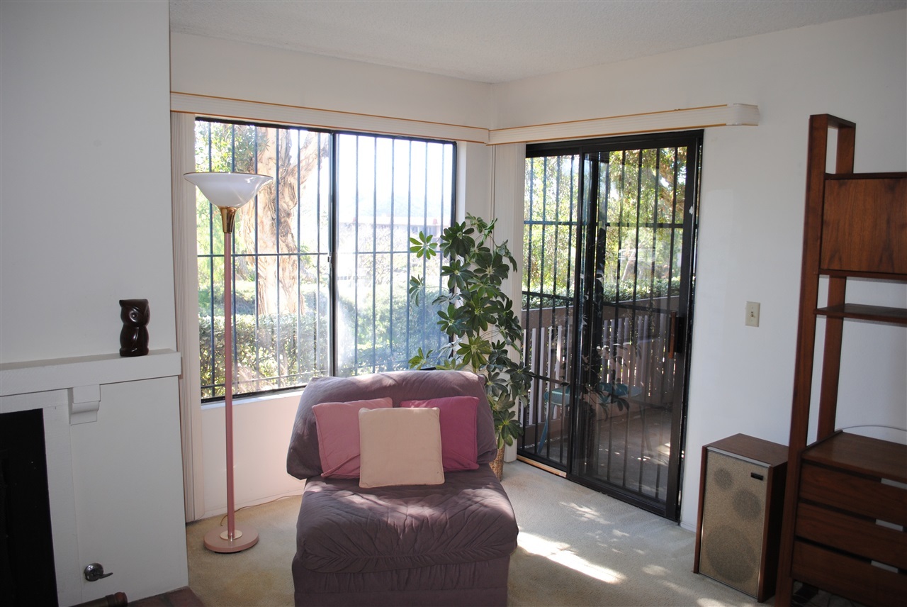 6343 Rancho Mission Road, Unit 2 San Diego, CA 92108 - Photo 2 of 24 Sitting next to fire place.