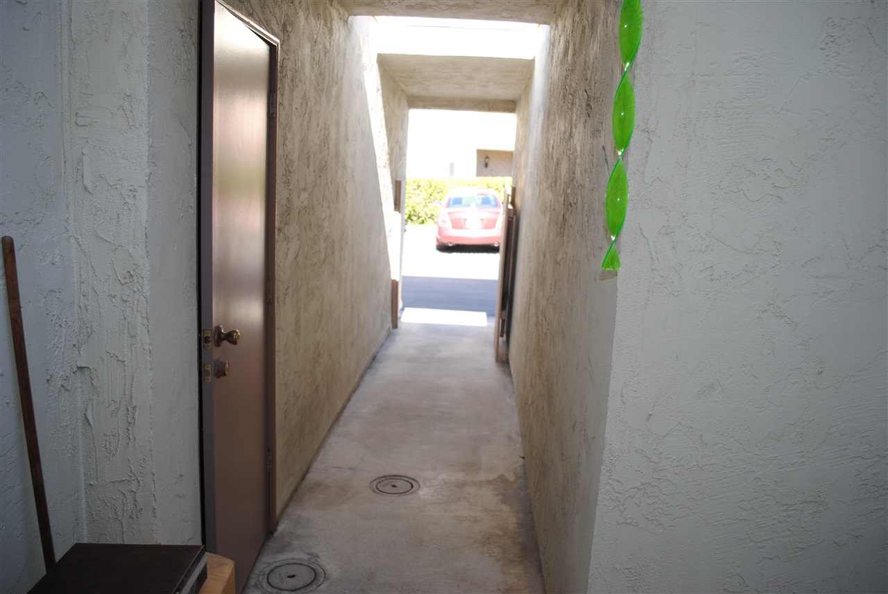 6343 Rancho Mission Road, Unit 2 San Diego, CA 92108 - Photo 14 of 24 Breeze way to private gate and garae.