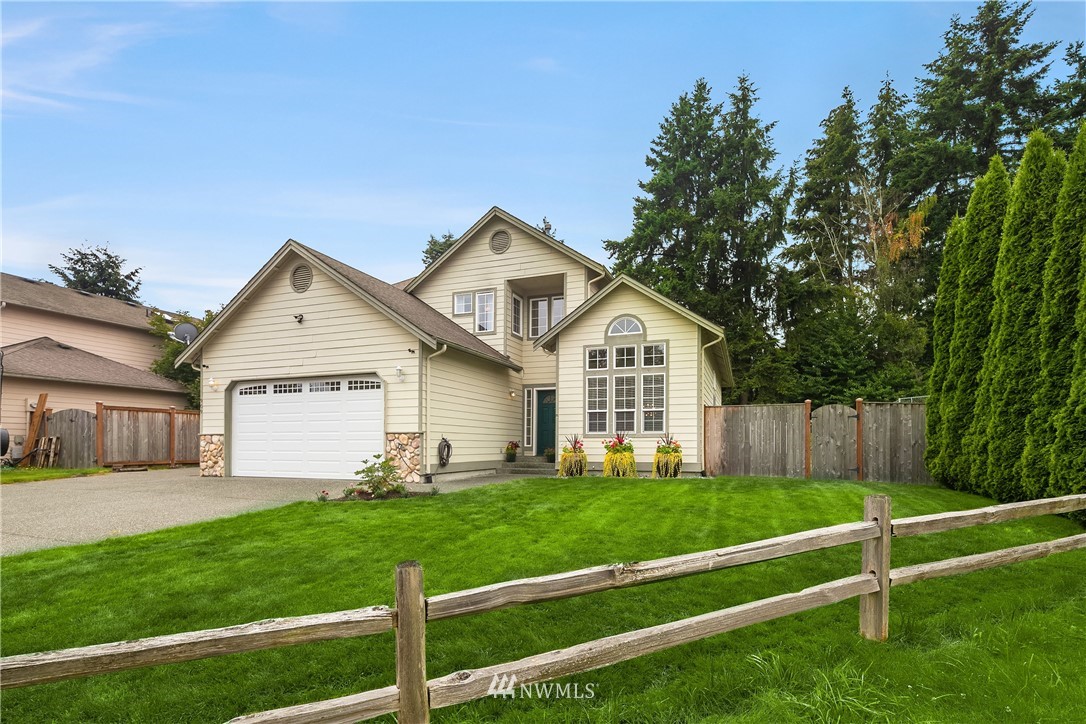 909 Graham Avenue Northeast Renton, WA 98059 - Photo 1 of 32 a view of a house with a yard and sitting area